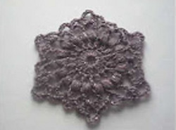   . . An openwork motive crocheted